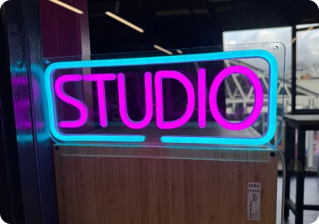 Neon sign reading "studio"
